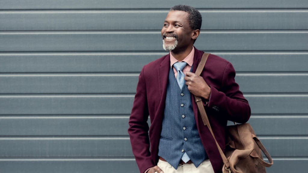 Stylish African American man in rich burgundy
